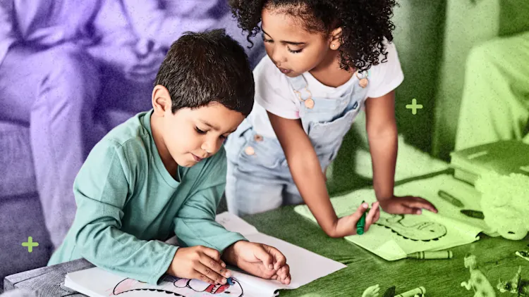 Two young children are drawing together at a table, surrounded by art supplies. One is focused on coloring, while the other observes and holds a green marker, ready to inspire creativity through their shared artwork.