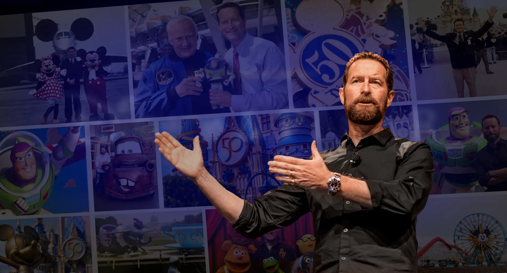 Duncan Wardle gestures while speaking on stage; behind him is a collage featuring Disney and Pixar characters, theme park images, and people posing at Disney events.